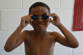 A Rutherford Pool visitor tests out new swim goggles.