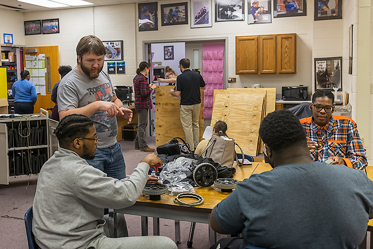 Grizzly Robotics mentor Peter Henning with students