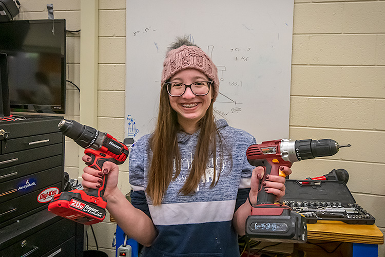 Kristin Williams working on a robot with Lincoln High School's Linc-Bots team