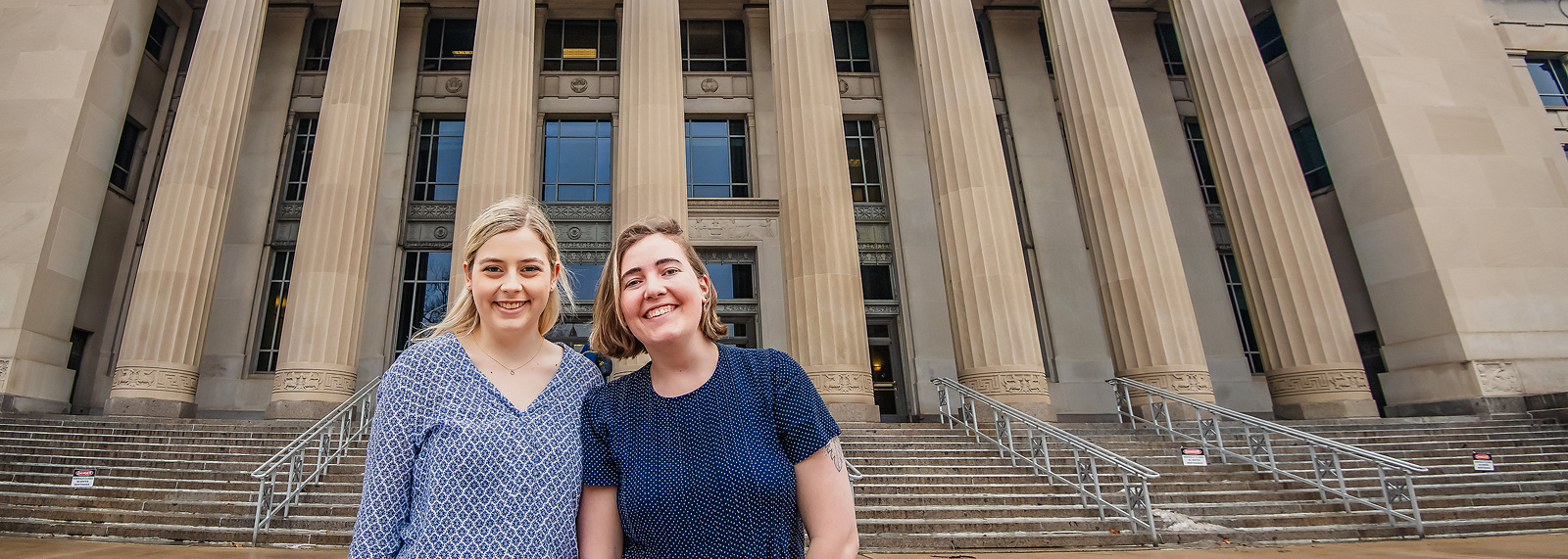 Griffin St. Onge and Lauren Schandevel of Affordable Michigan outside of Angell Hall