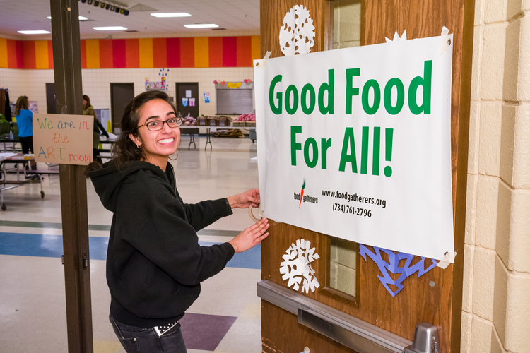 A Food Gatherers staffer sets up for a mobile food distribution.