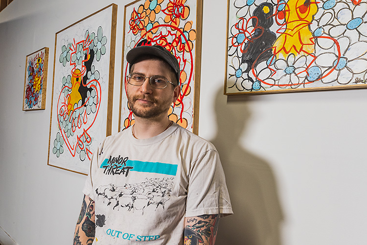 Brennan Greaves and his paintings at The Hosting.