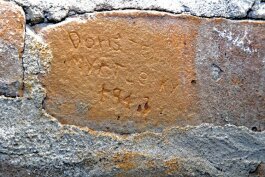 The names "Doris" and "Myrtle" are carved into a chimney at 108 N. Maple.