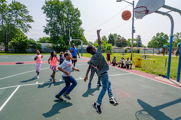 A game of basketball during Y on the Fly in West Willow Park.