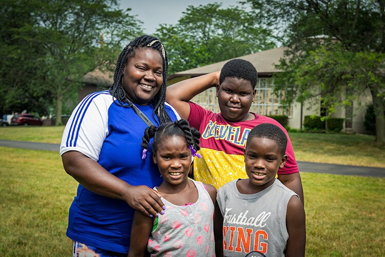 Neshada Green with her children at Grace Fellowship Church House of Solutions.