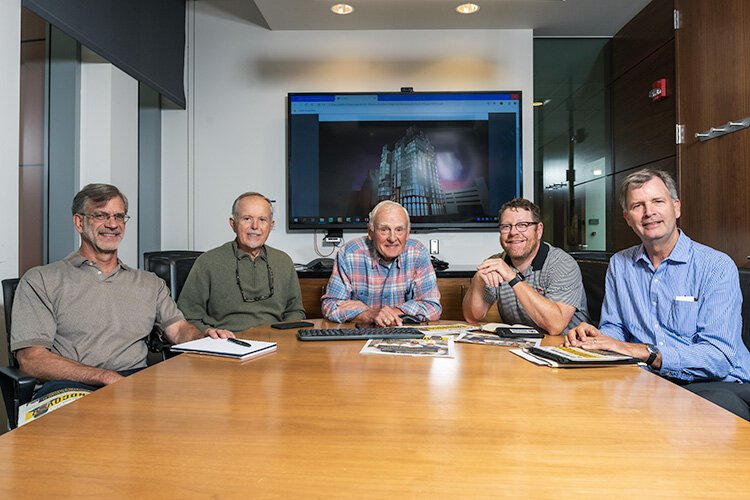 Brian Chambers, Doug Kelbaugh, Peter Allen, Chip Smith, and Greg Holcombe meet at the Ross School of Business to discuss affordable housing in Ann Arbor.