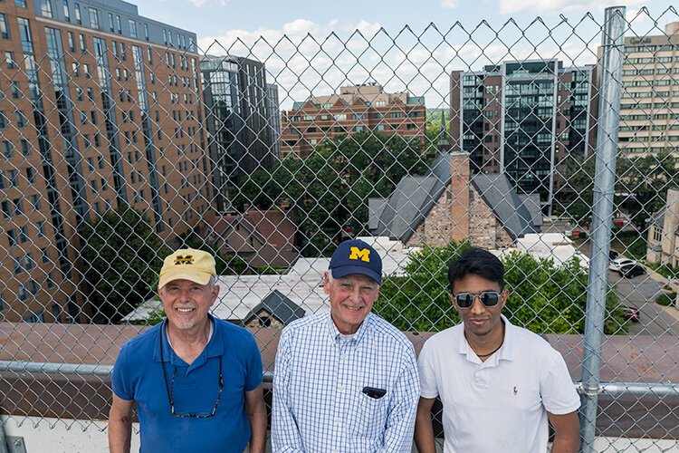 Doug Kelbaugh, Peter Allen, and Kazi Najeeb Hasan at a potential development site on top of the Liberty Square parking structure.