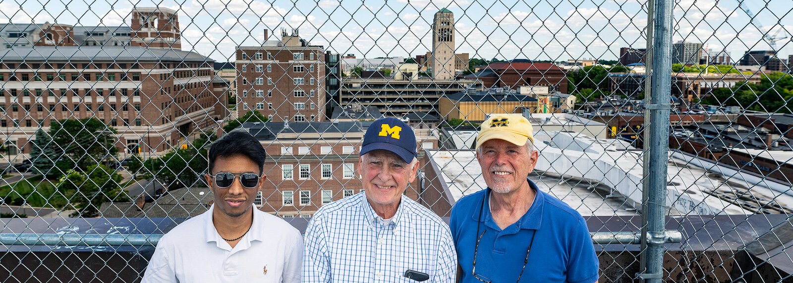 Kazi Najeeb Hasan, Peter Allen, and Doug Kelbaugh at a potential development site on top of the Liberty Square parking structure.