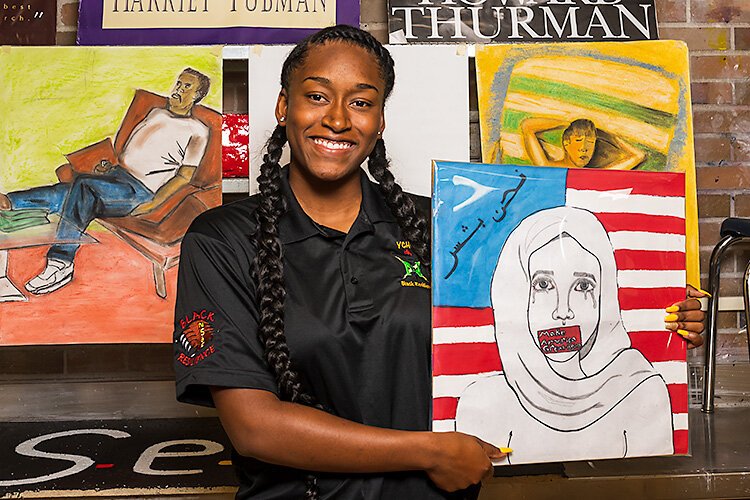 YCS student Amara Herron with her art work.