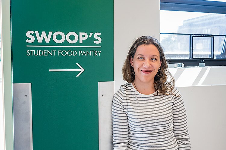 Eliza Caughey working at Swoop's Food Pantry at EMU .