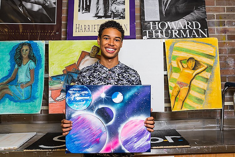 YCS student Jaylin Crandall with his art work.