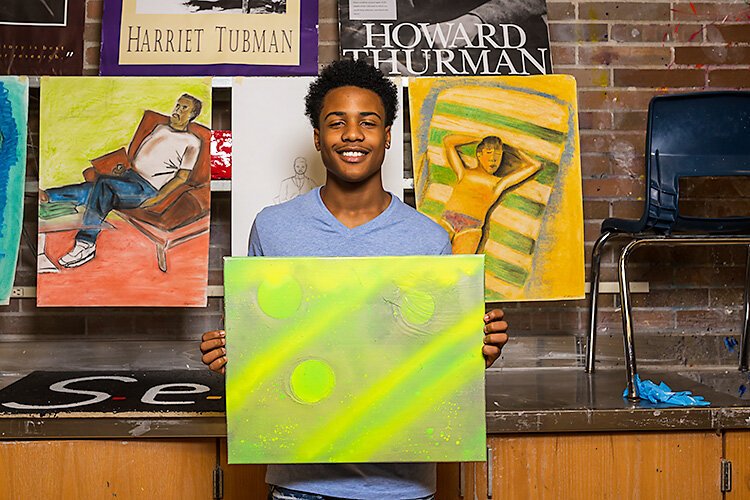 YCS student Semaj Richards with his art work.