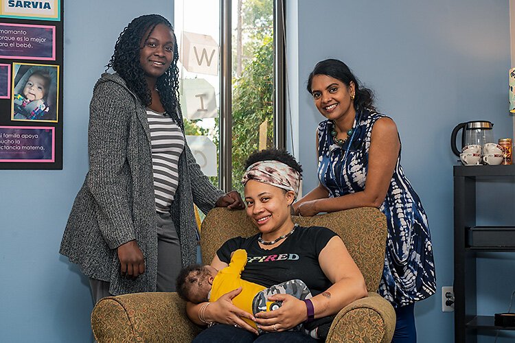 Dera Williams, Najma Treadwell with her son Jahleel, and Gayathri Akela at the breastfeeding lounge at the Washtenaw County WIC office.