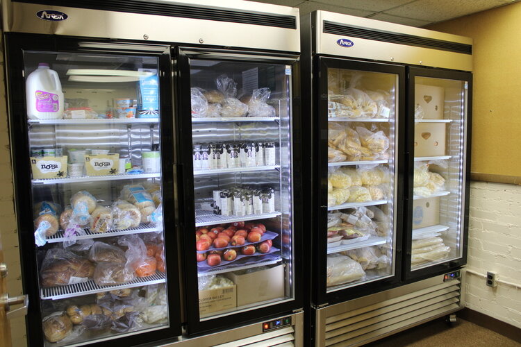 A refrigerator and freezer in the food pantry at Community Action Network's Brick Community Center, funded by a county grant.