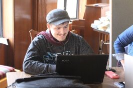 A student at the Early College Alliance at EMU works on his computer.
