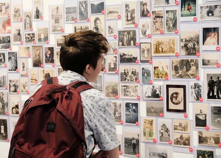 A visitor views the "Take Your Pick" exhibit at UMMA.