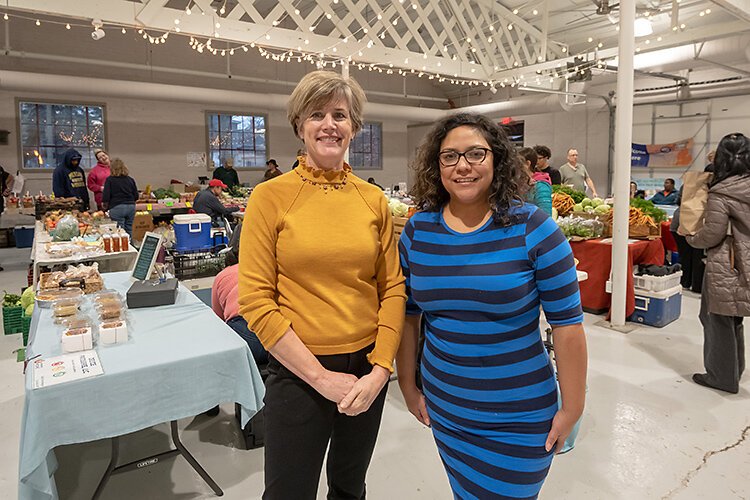 Growing Hope's Cynthia VanRenterghem and Elisa Marroquin at Robert C. Barnes Sr. Marketplace Hall.