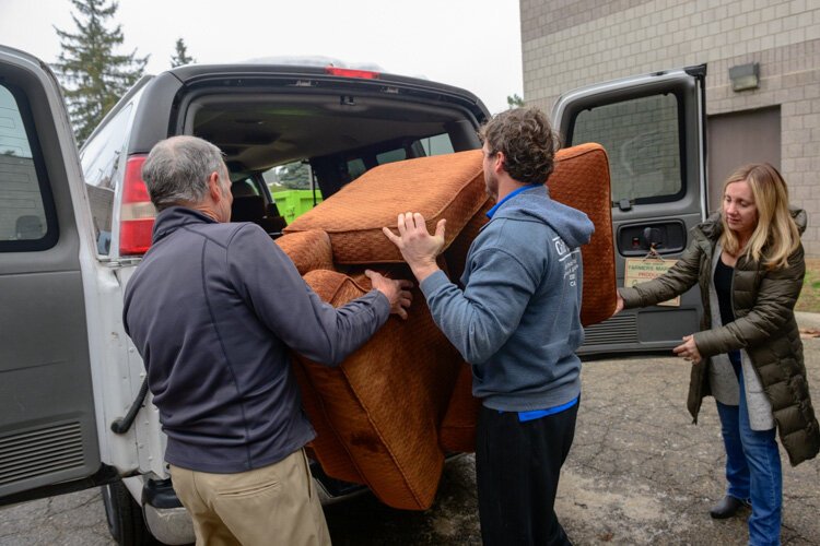 House N2 Home volunteers loading furniture for Brittani Brooks.