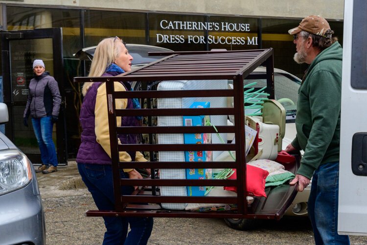 House N2 Home volunteers loading furniture for Brittani Brooks.