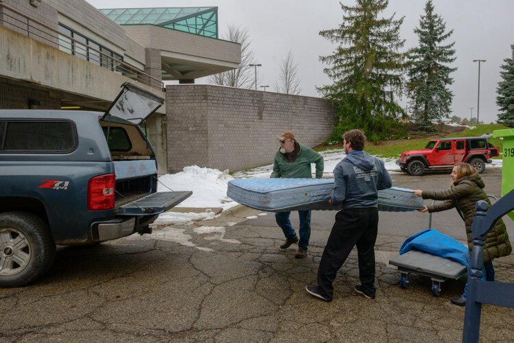 House N2 Home volunteers loading furniture for Brittani Brooks.