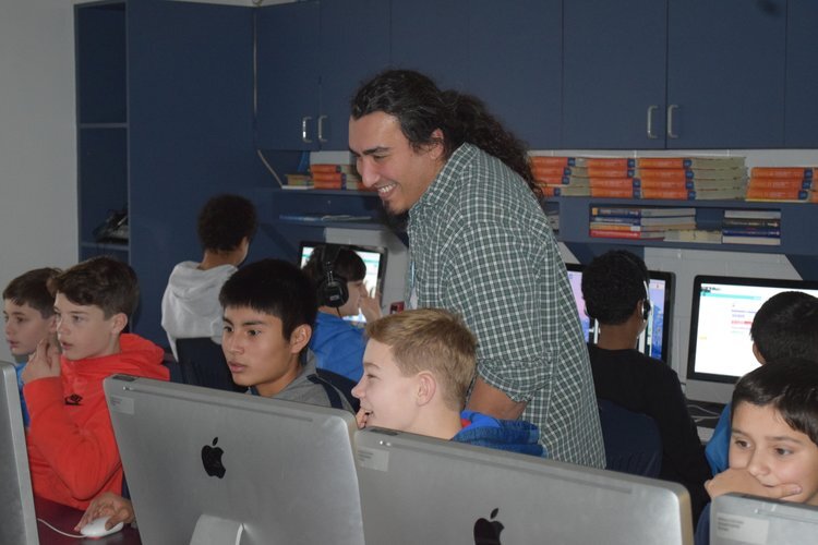 Herb Torres of Hook Studios works with Tappan Elementary students during last year's Hour of Code.