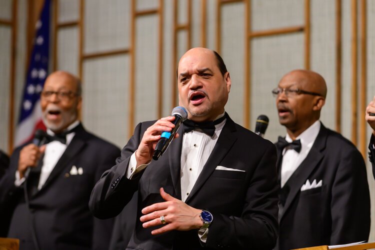 Dwight Fontenot leads the Men's Choir at Community Church of God.