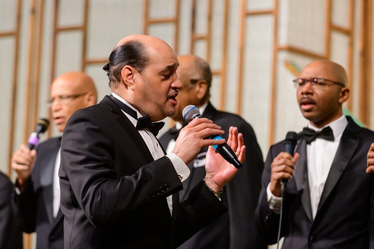 Dwight Fontenot leads the Men's Choir at Community Church of God.