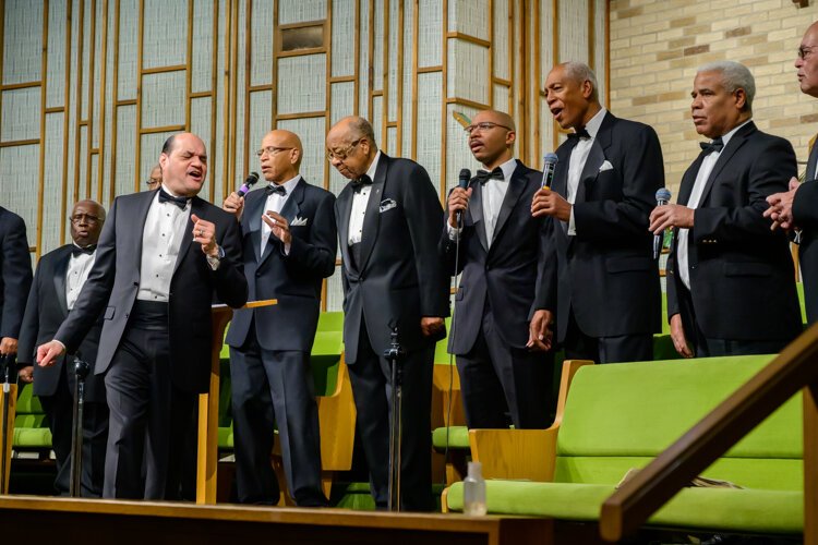 Dwight Fontenot leads the Men's Choir at Community Church of God.