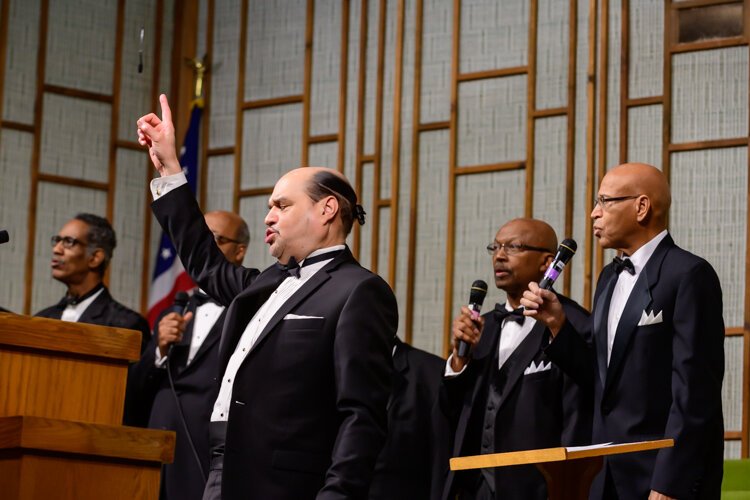 Dwight Fontenot leads the Men's Choir at Community Church of God.