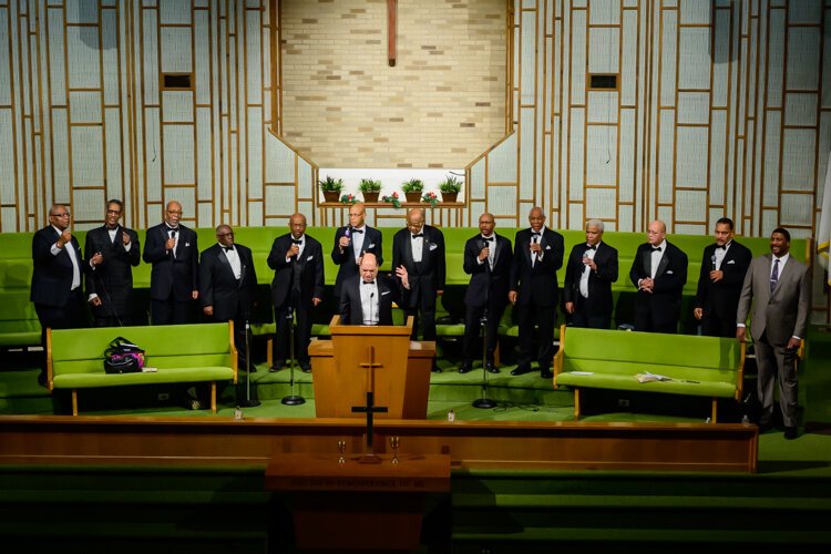 Dwight Fontenot leads the Men's Choir at Community Church of God.