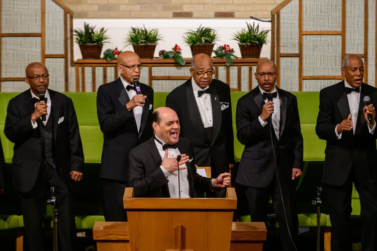 Dwight Fontenot leads the Men's Choir at Community Church of God.