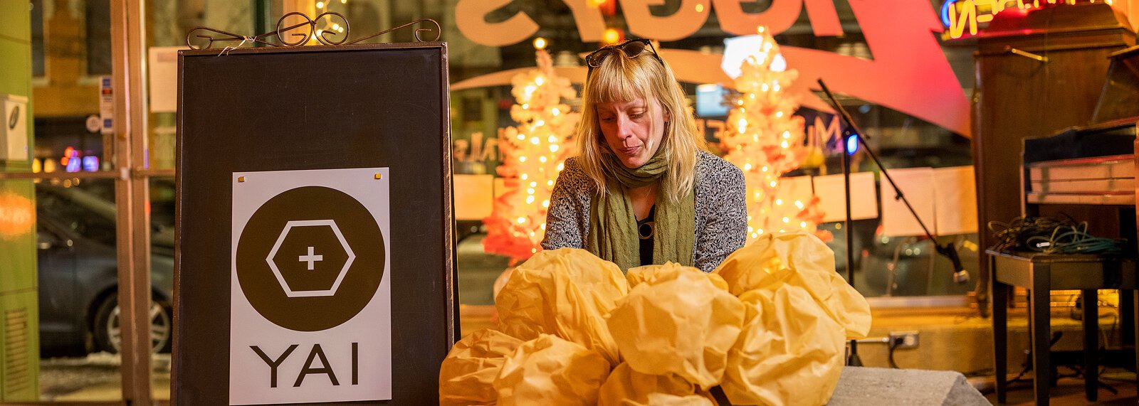 Ypsilanti Art Incubator's Alexa Dietz with her sculpture "Monopoly" at Ziggy's.