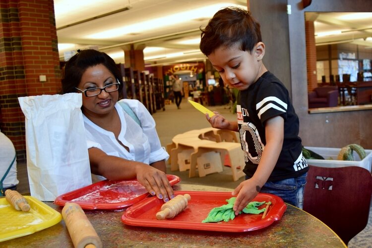 A child makes homemade clay at last year's preschool resource fair.