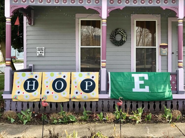 Signs displayed on a house in Ypsi.