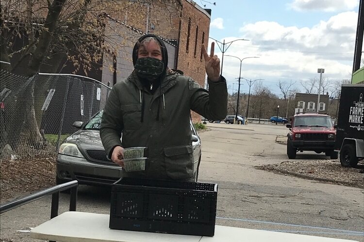 A staffer prepares for one of the Ypsi Area Online Market's first food distributions.