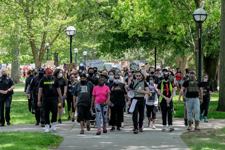 Protestors leave the Diag, embarking on a march through Ann Arbor.