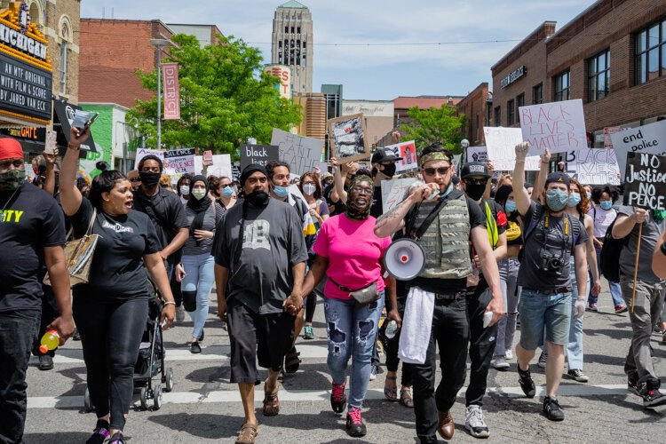 Protestors march through downtown Ann Arbor.