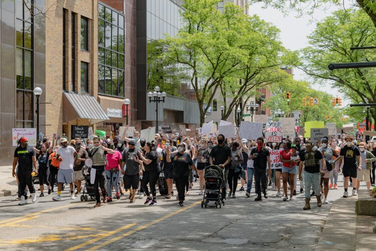 Protestors march down Main Street in Ann Arbor.