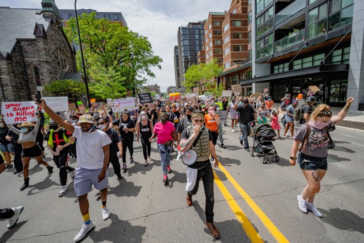 Protestors march through downtown Ann Arbor.