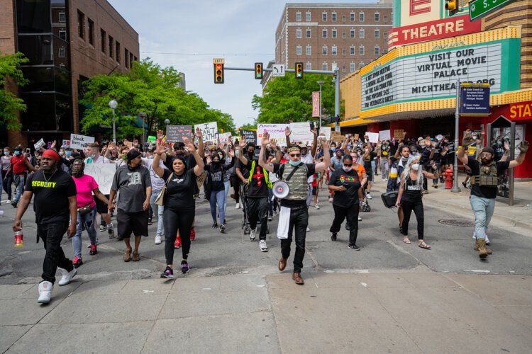 Protestors march through downtown Ann Arbor.