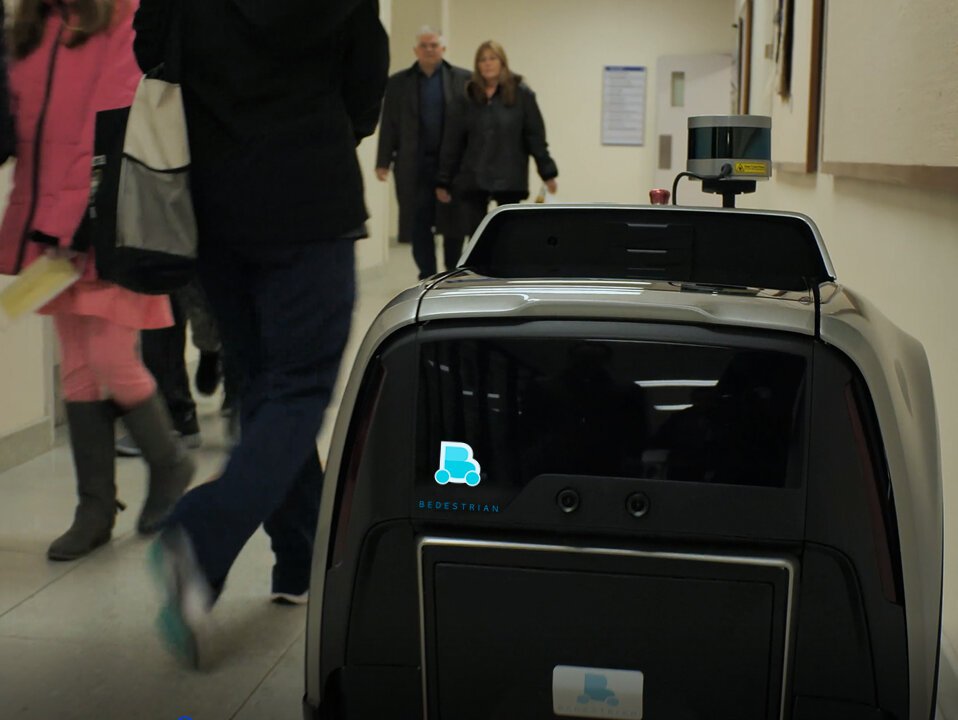 A Bedestrian B1 robot makes a delivery in a hospital.
