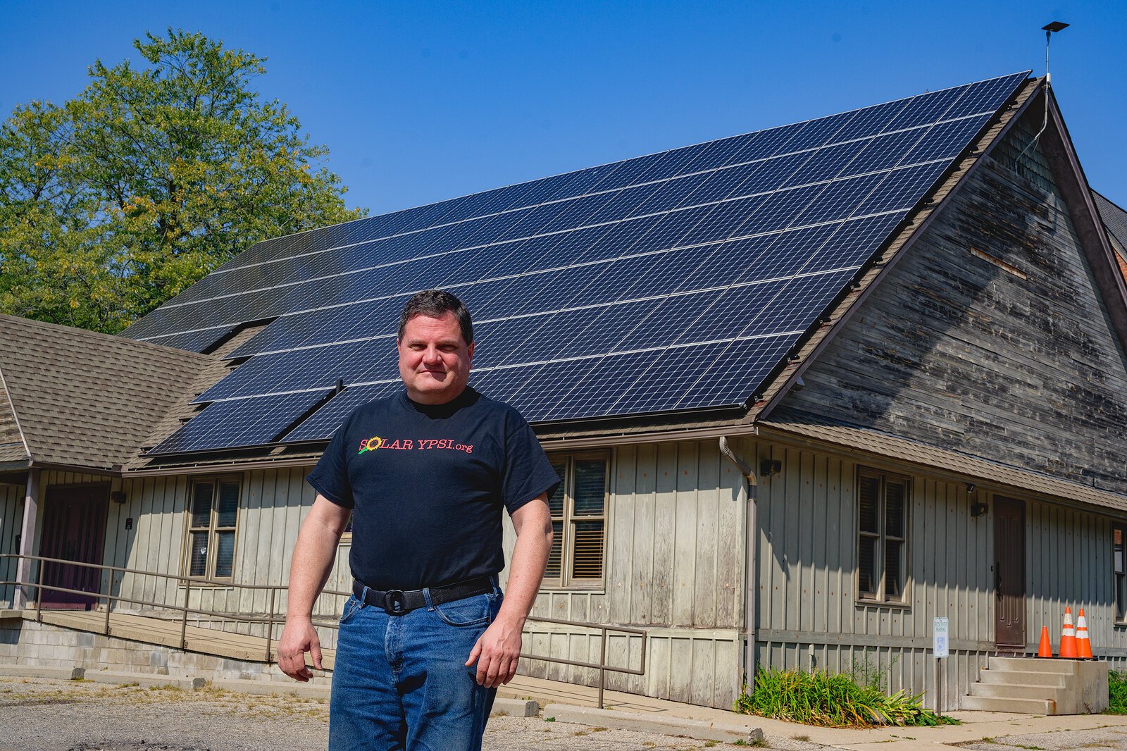 Steve Pierce stands in front of the solar roof at The YPSI.
