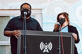 Rod Wallace of Grove Studios and Maia Evans of Leon Speakers announce the Amplify Fellowship at Grove Studios' Equinox Party.