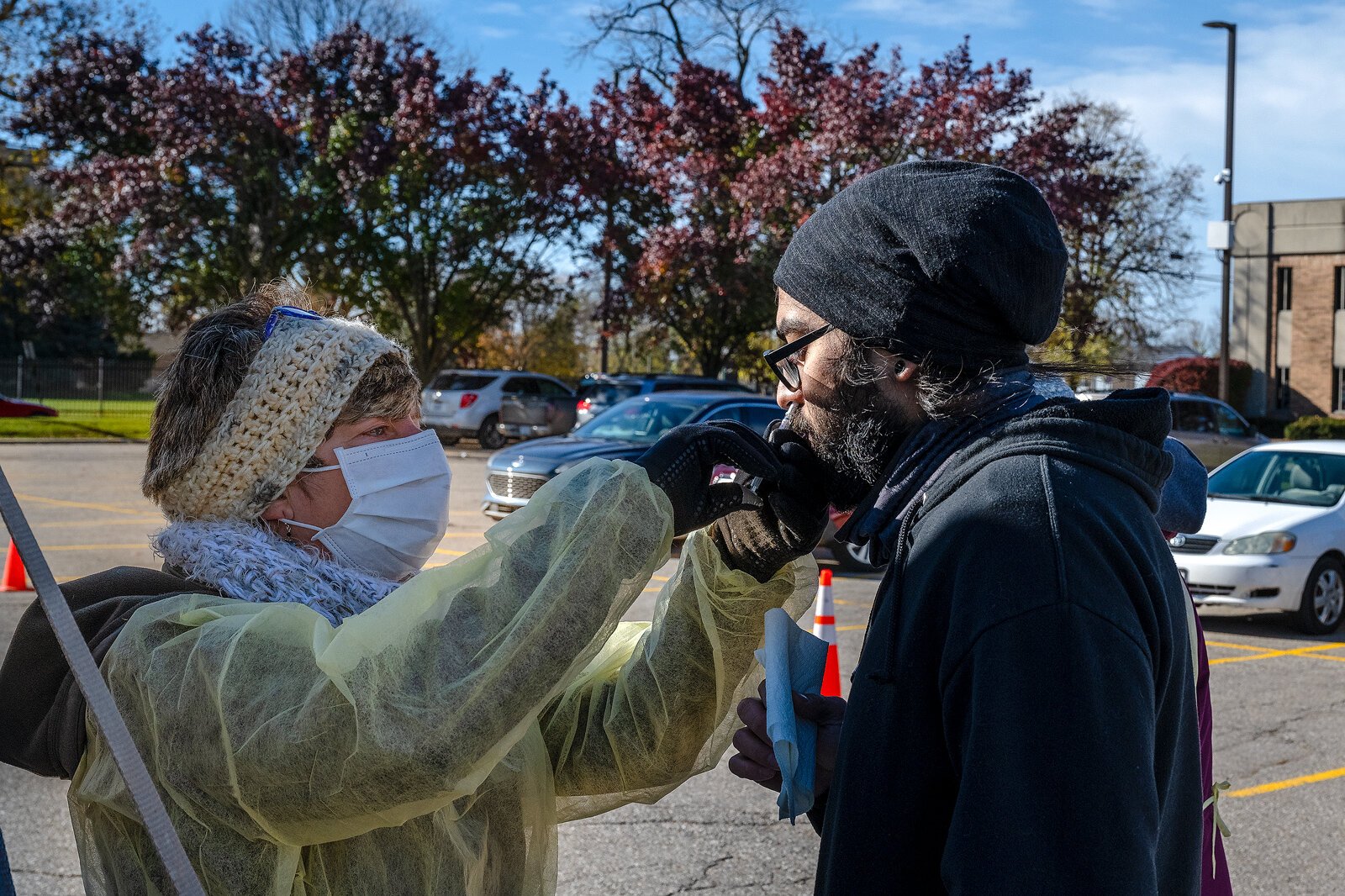 A nasal flu vaccine is administered in the Washtenaw County Health Department parking lot in Ypsilanti.