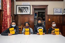 L to R Educate Youth students Morgan Hargrove, Breanna Mayers, Lehana Mayers, and Reese Weatherspoon with copies of the "Spiritual Warriors" poetry book.