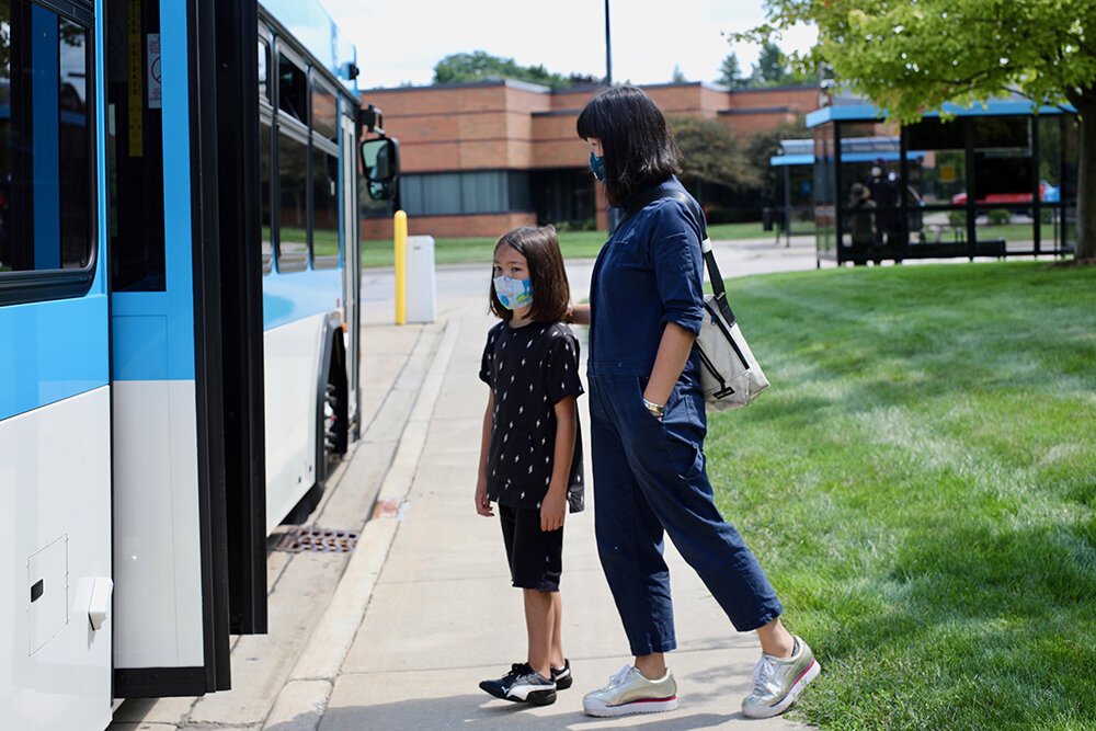 Riders board an AAATA bus.