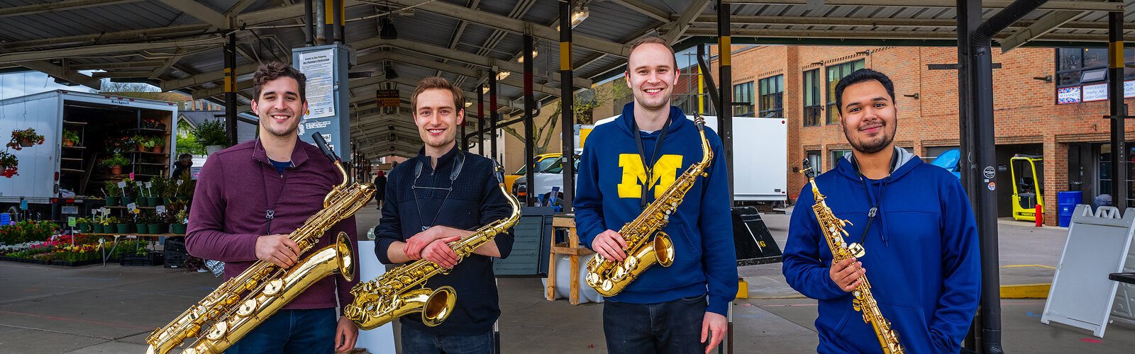 Matthew Koester, Andrew MacRossie, Walt Puyear, and Salvador Flores during an Ann Arbor Camerata performance at Kerrytown Farmers Market.