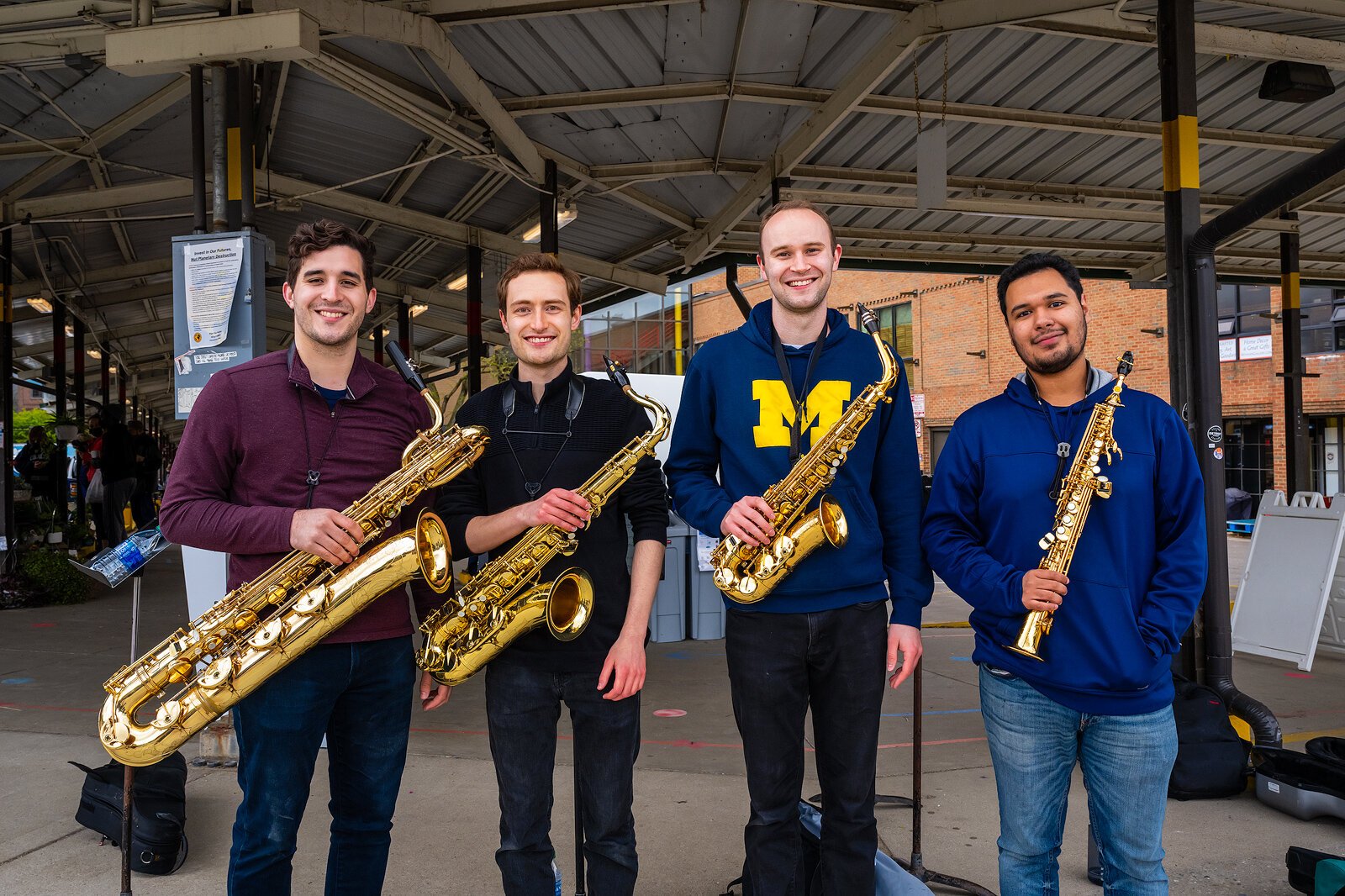 Matthew Koester, Andrew MacRossie, Walt Puyear, and Salvador Flores during an Ann Arbor Camerata performance at Kerrytown Farmers Market.