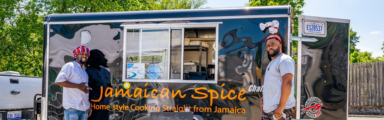 Valancio Bailey and Donandre McNish with the Jamaican Spice food truck at York in Ann Arbor.