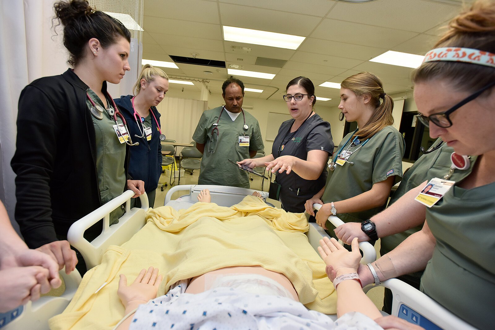 WCC nursing students work with a human simulator.
